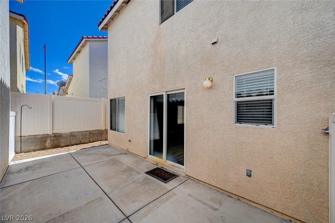 7259 Cestrum Road Las Vegas, NV 89113 - Photo 27 of 35 A spacious concrete patio awaits, perfect for outdoor living and entertaining.