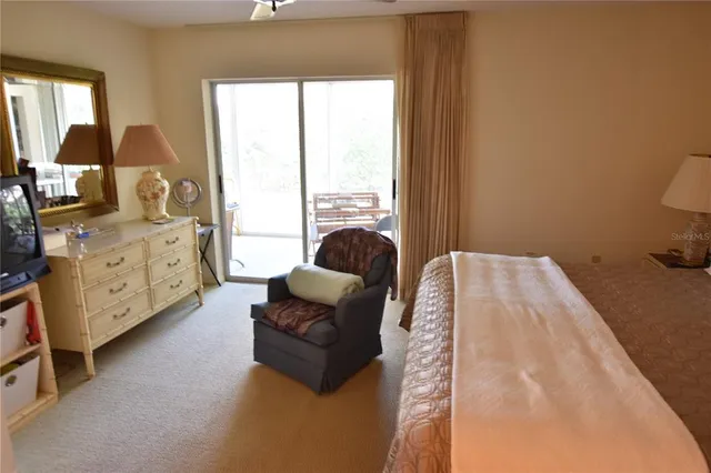 a bedroom with furniture and a window