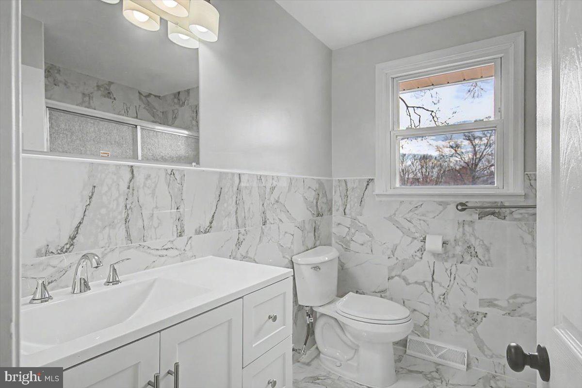 2209 Riviera Lane Wilmington, DE 19810 - Photo 25 of 43 a bathroom with a sink toilet and shower