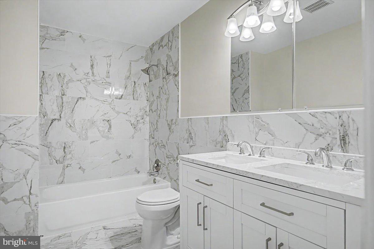 2209 Riviera Lane Wilmington, DE 19810 - Photo 27 of 43 a bathroom with a sink a toilet a bathtub a mirror and shower