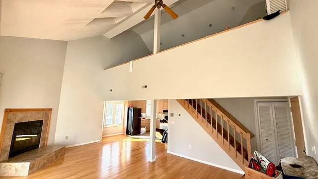a view of an entryway with wooden floor