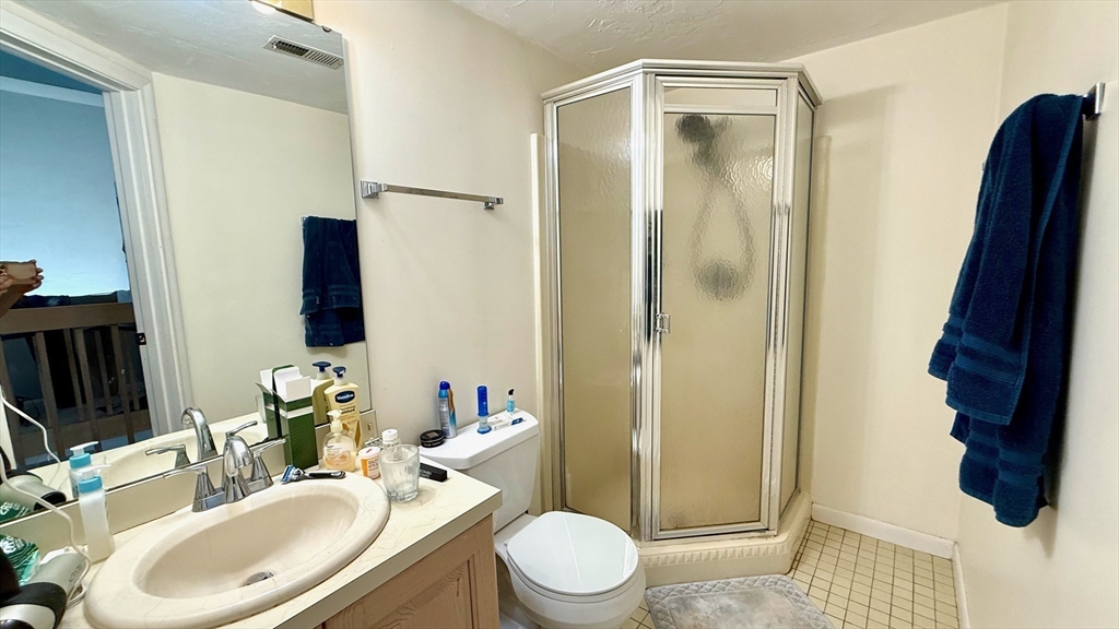 114 Burkhall Street, Unit R Weymouth, MA 02190 - Photo 15 of 15 a bathroom with a sink toilet and shower