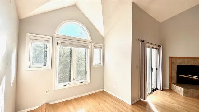 a view of livingroom with furniture flat screen tv and wooden floor