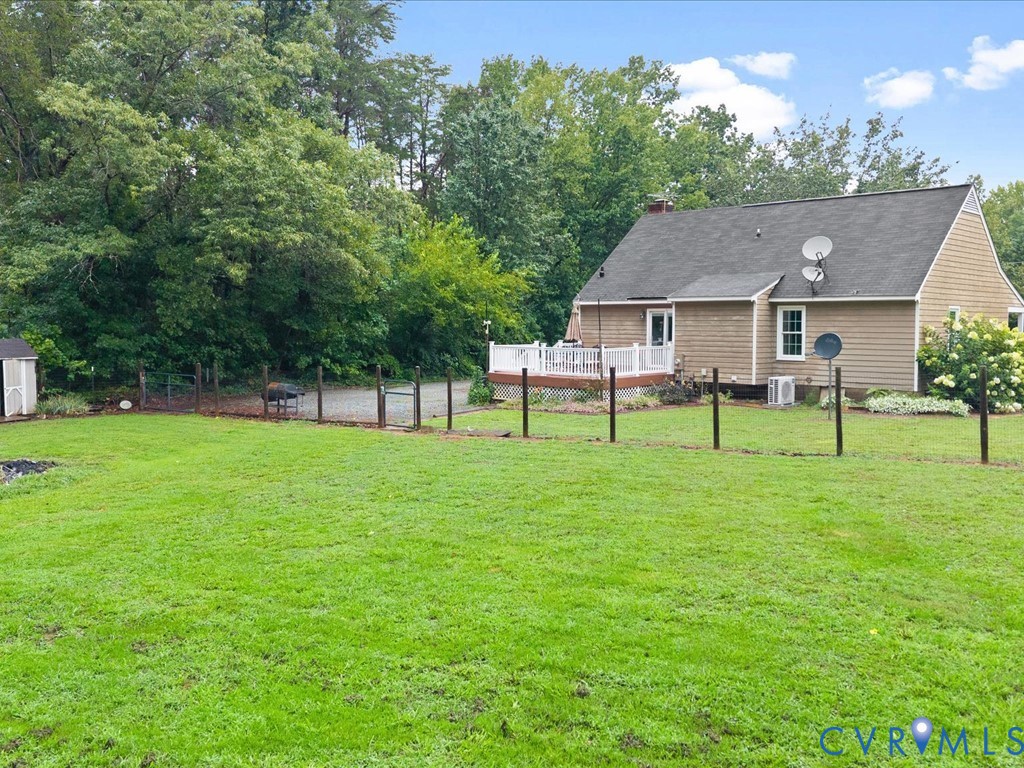 3695 Three Chopt Road Gum Spring, VA 23065 - Photo 53 of 55 Expansive green lawn with a tan siding residence f