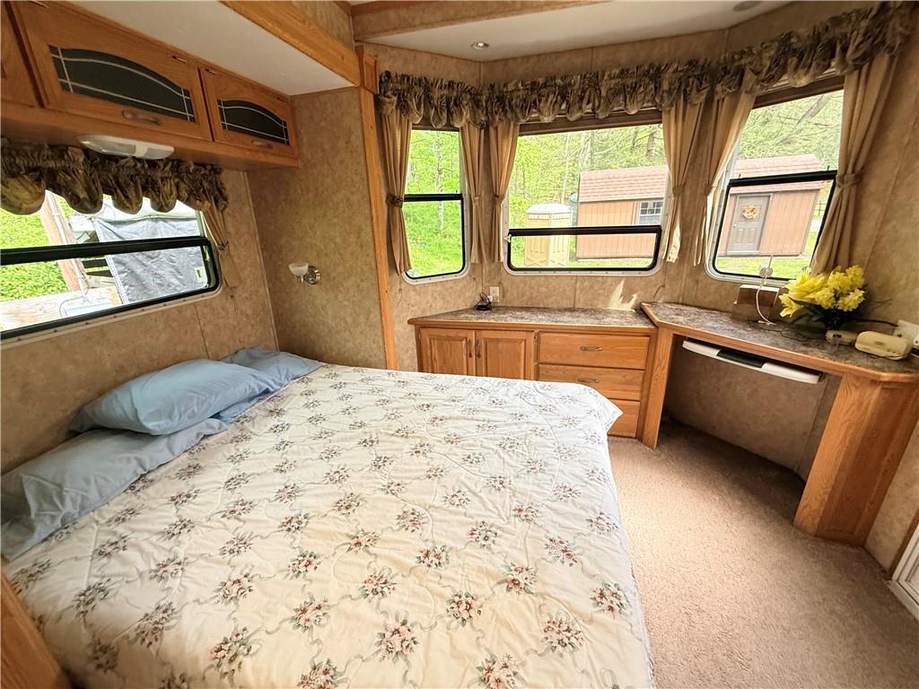 321 Dark Hollow Road Confluence, PA 15424 - Photo 13 of 18 a bedroom with a large bed and a window
