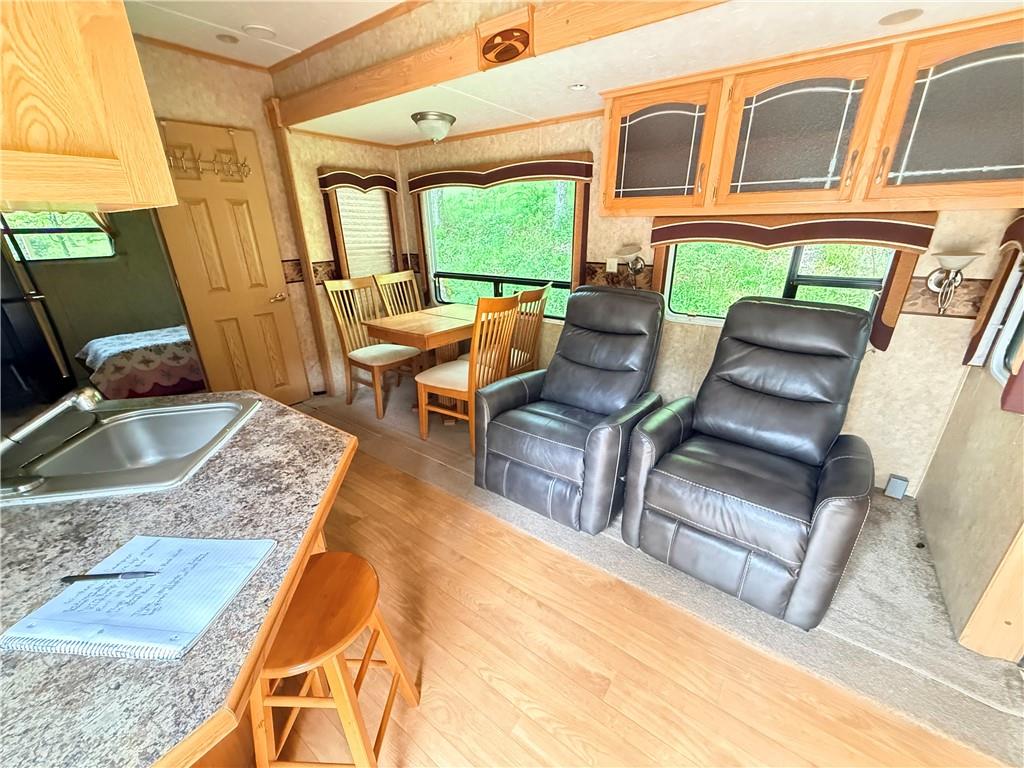 321 Dark Hollow Road Confluence, PA 15424 - Photo 14 of 18 a living room with furniture rug and a large window