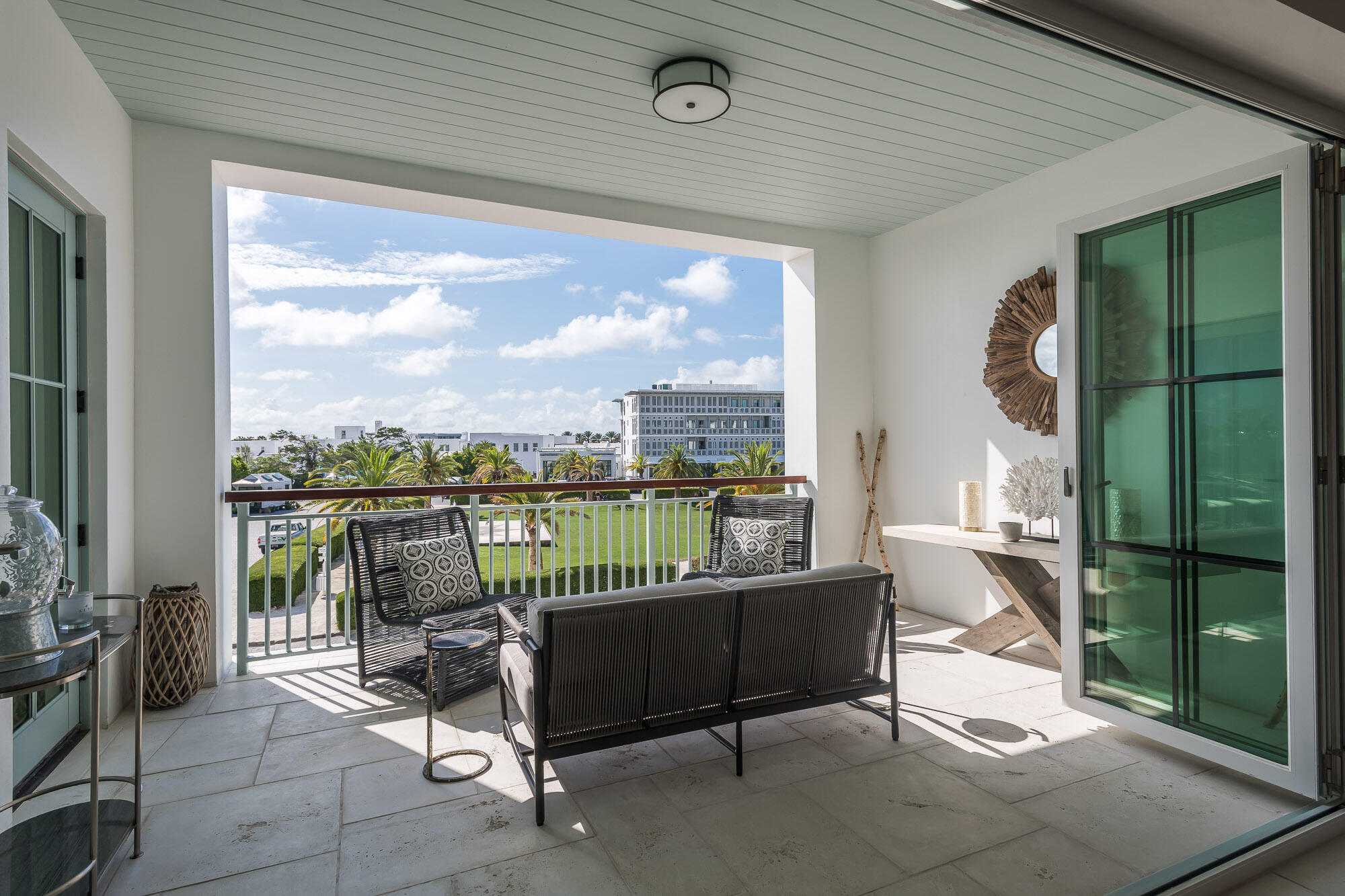74 Governors Ct Inlet Beach, Unit W202 Inlet Beach, FL 32461 - Photo 9 of 29 a balcony with furniture and a floor to ceiling window
