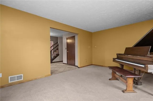a kitchen with granite countertop stainless steel appliances and wooden cabinets