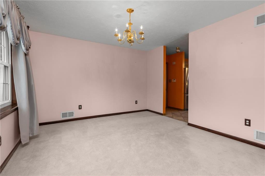 223 Balsinger Road Uniontown, PA 15401 - Photo 21 of 50 a view of an empty room with a chandelier