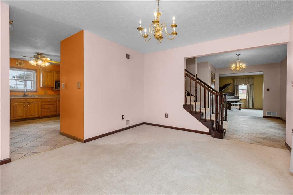 223 Balsinger Road Uniontown, PA 15401 - Photo 22 of 50 a view of a hallway with entryway and chandelier