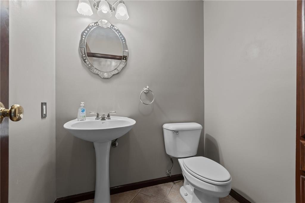 223 Balsinger Road Uniontown, PA 15401 - Photo 22 of 50 a bathroom with a toilet sink and mirror