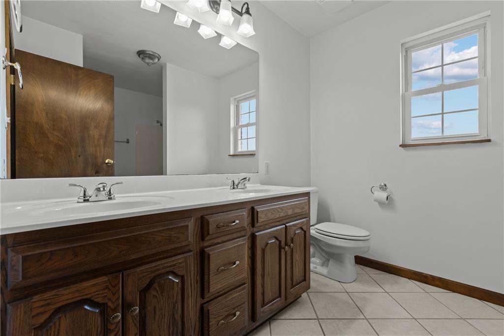 223 Balsinger Road Uniontown, PA 15401 - Photo 29 of 50 a bathroom with a toilet sink and mirror