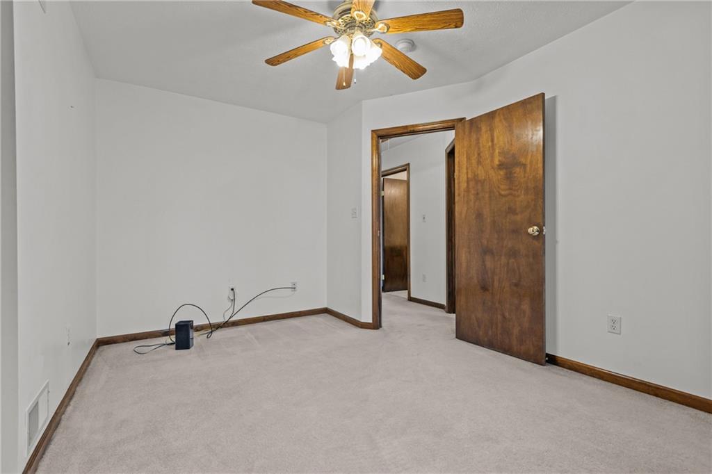223 Balsinger Road Uniontown, PA 15401 - Photo 35 of 50 an empty room with closet and a chandelier fan