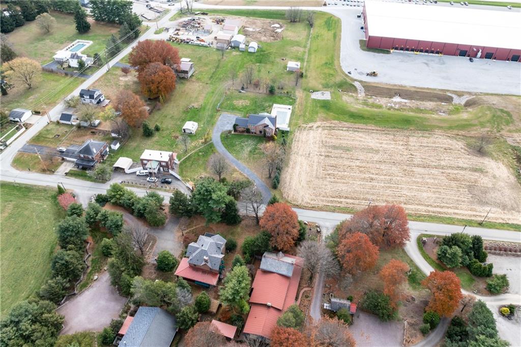 223 Balsinger Road Uniontown, PA 15401 - Photo 45 of 50 a aerial view of a house with outdoor space and a lake view in back