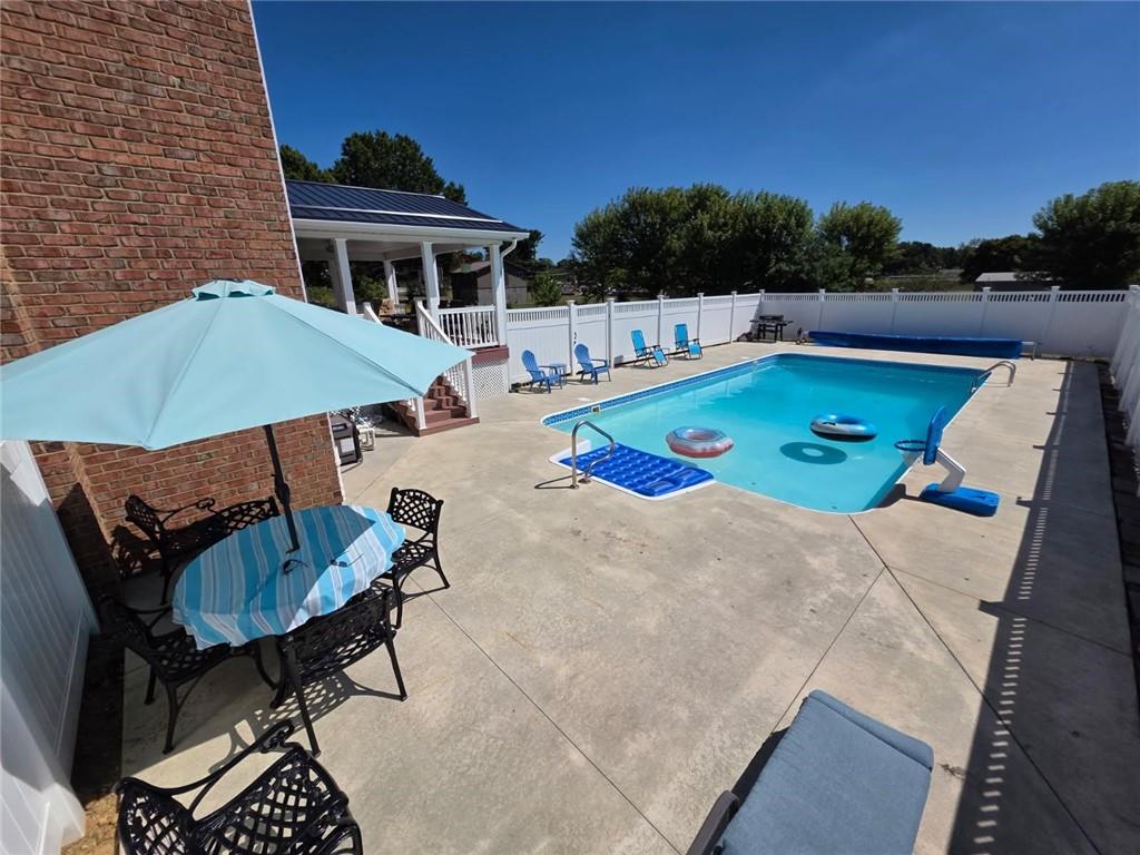 223 Balsinger Road Uniontown, PA 15401 - Photo 7 of 50 swimming pool view with a seating space