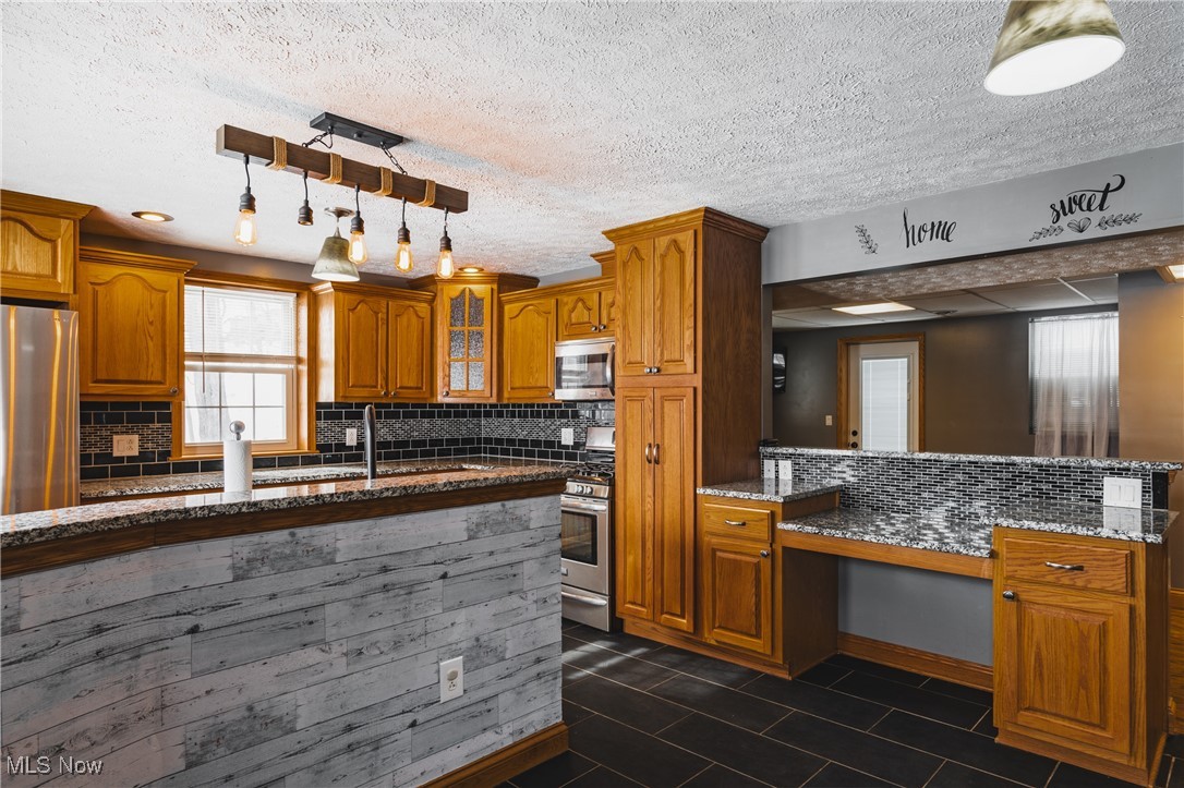 111 River Hill Road Washington, WV 26181 - Photo 3 of 29 A cook will love this kitchen area. Easy reach to all appliances, Granite countertops, plenty of Oak cabinetry including a pantry, tile flooring beautiful backsplash. What else could one want?