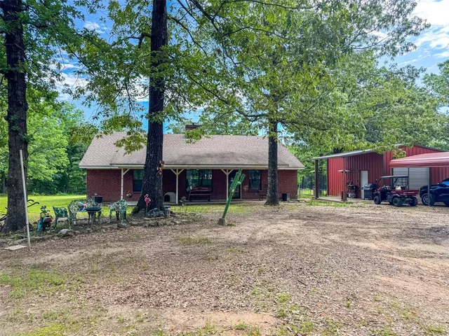 a house that has a tree in front of it