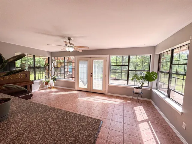 a view of a room with a large window