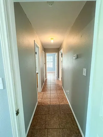 a view of room with a ceiling fan and window