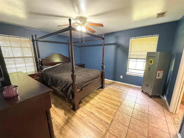 a bathroom with a sink mirror and a shower