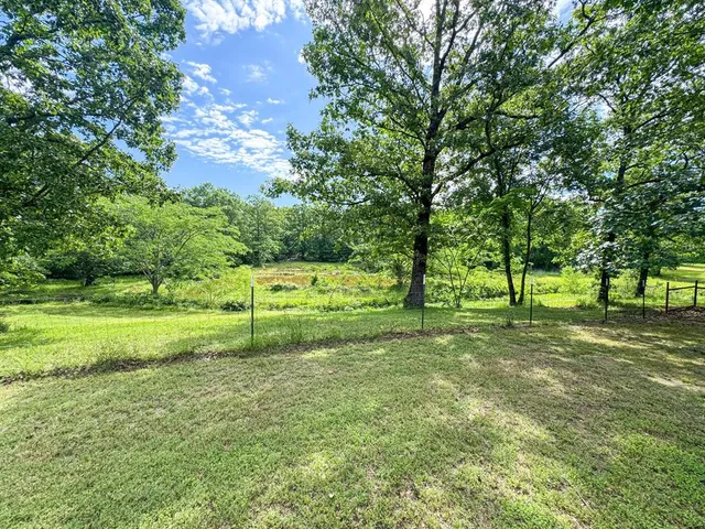 a view of outdoor space with deck and yard