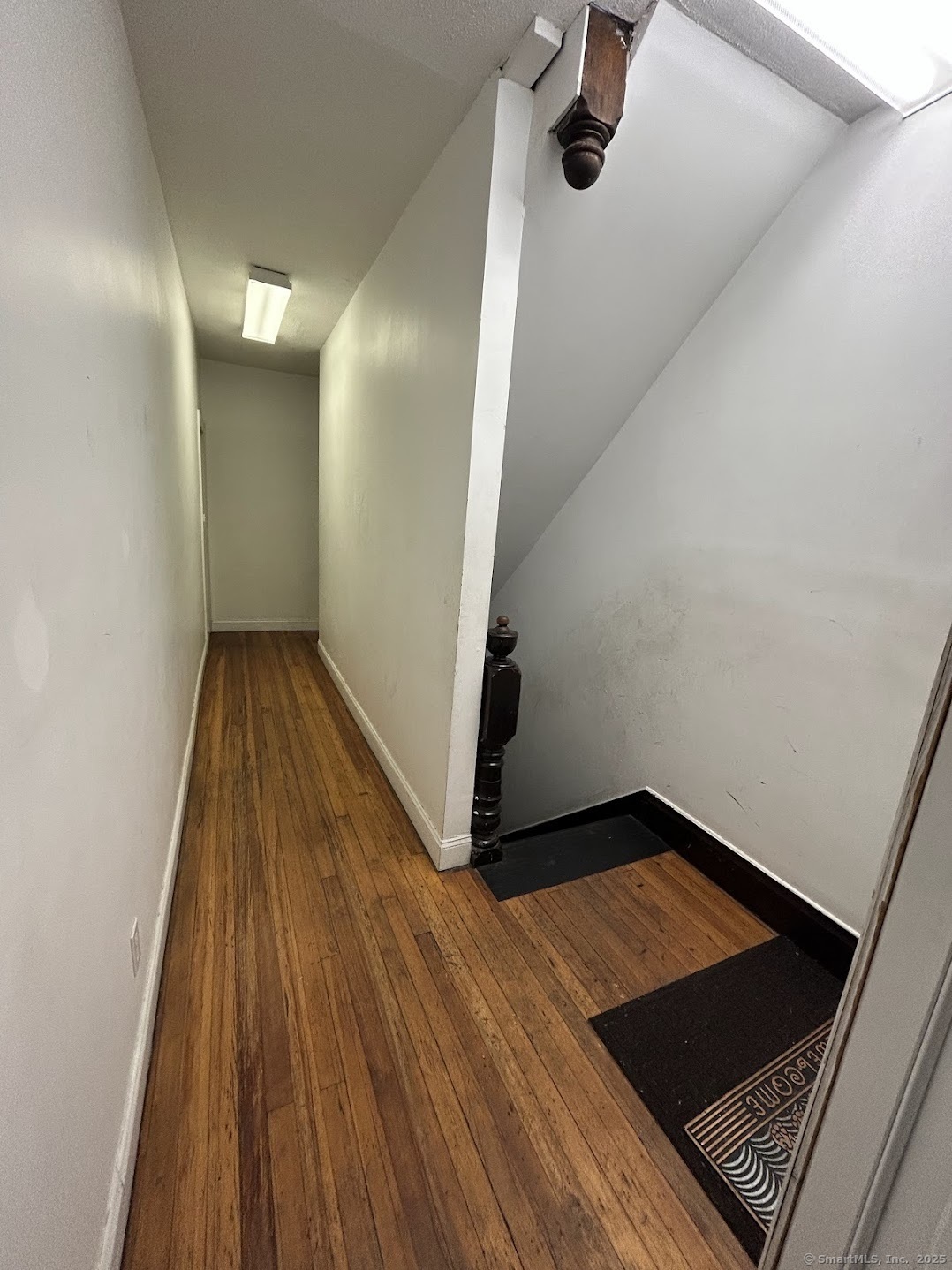 14 Relay Place, Unit L2 Stamford, CT 06901 - Photo 11 of 15 a view of a hallway with wooden floor