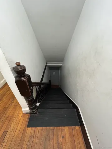 a view of entryway with wooden floor