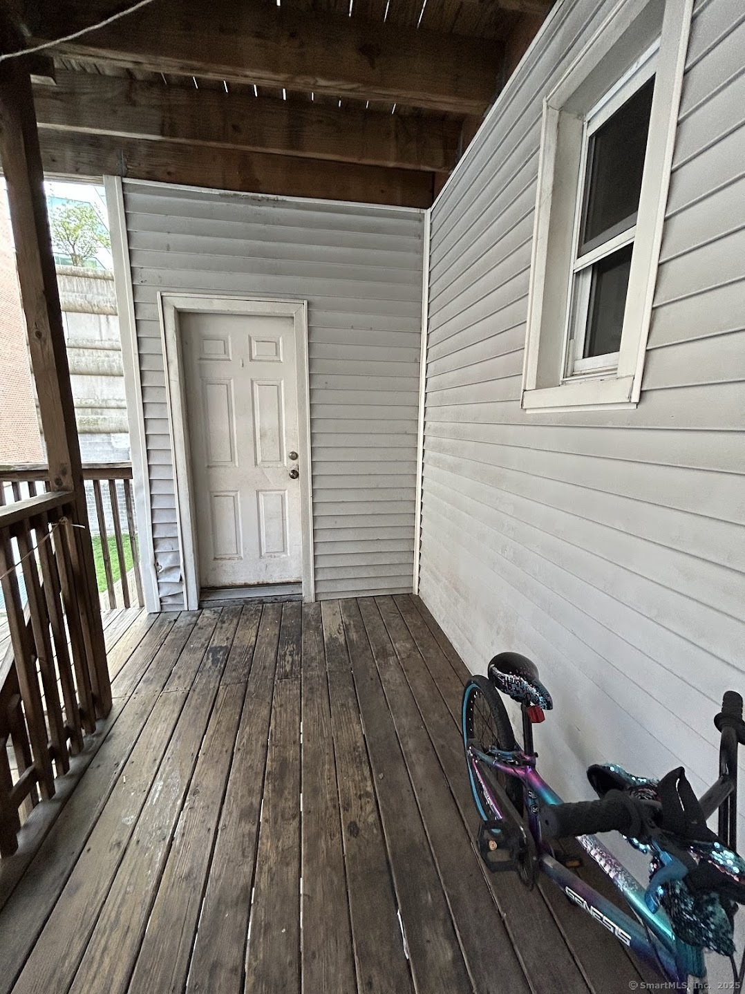 14 Relay Place, Unit L2 Stamford, CT 06901 - Photo 13 of 15 a view of a house with wooden deck
