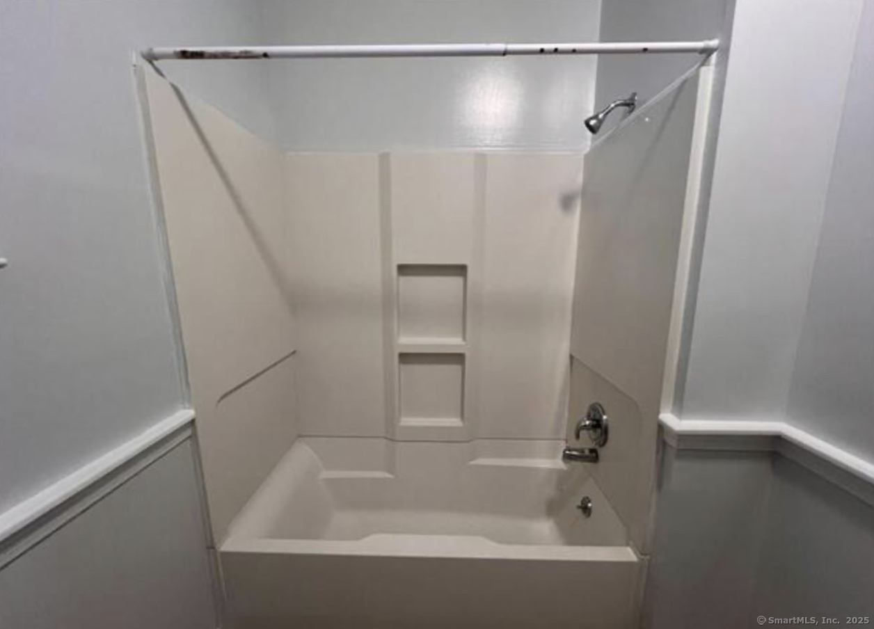 14 Relay Place, Unit L2 Stamford, CT 06901 - Photo 7 of 15 a bathroom with a shower and a bath tub