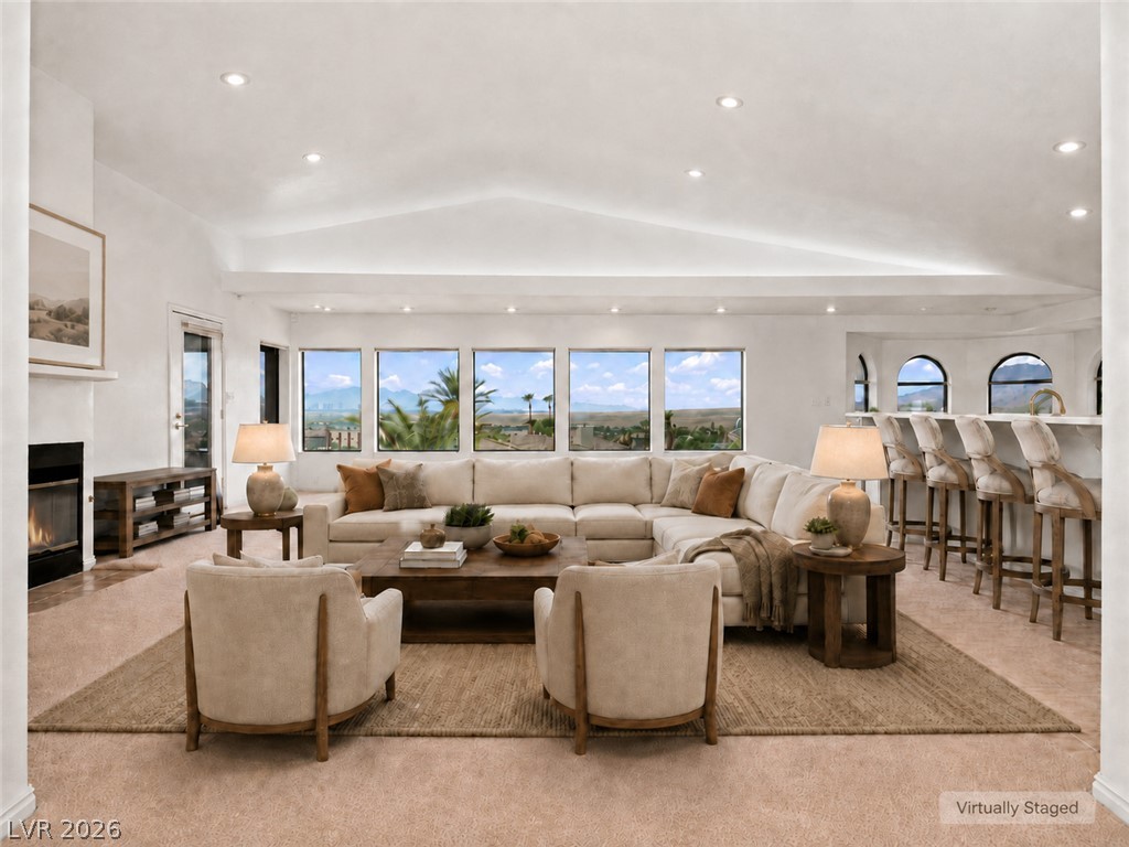 1068 Calico Ridge Drive Henderson, NV 89011 - Photo 18 of 38 Vaulted ceilings and a classic fireplace anchor this light-filled room Las Vegas Strip views.
