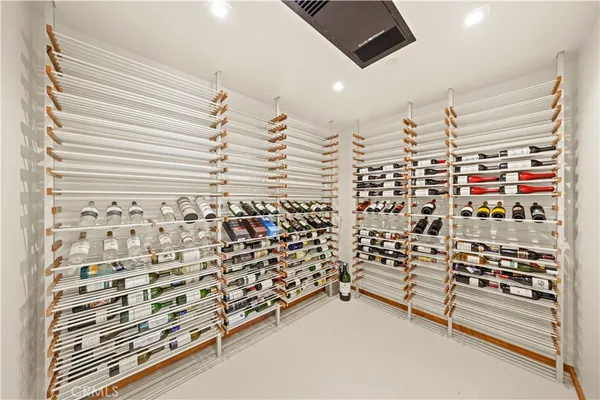 a living room with furniture and large windows