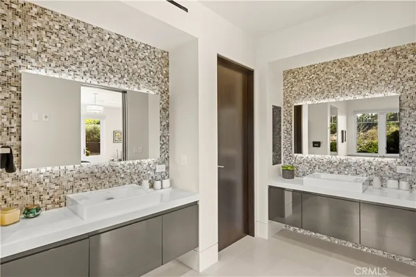 a spacious bedroom with a bed and wooden floor