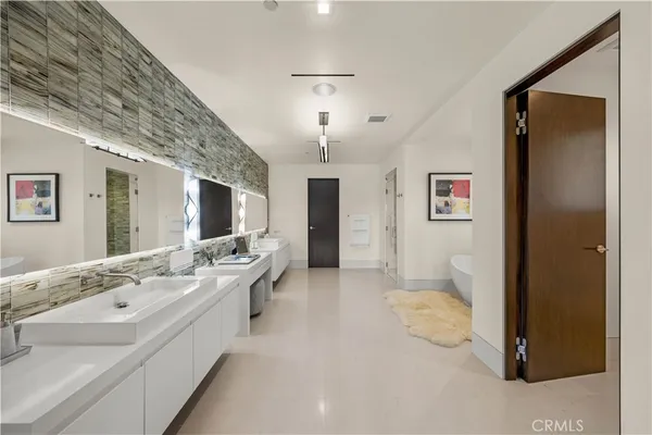 a bed room with a bed and a chair