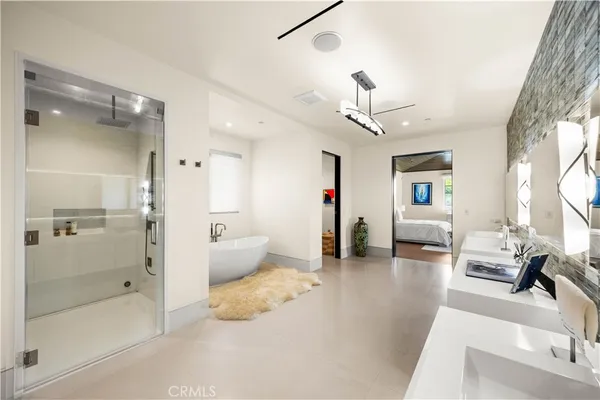 front view of a brick house with potted plants