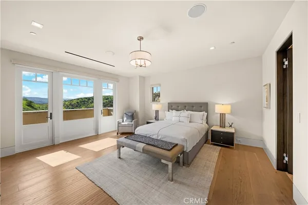 a view of a chairs and table in the backyard of a house