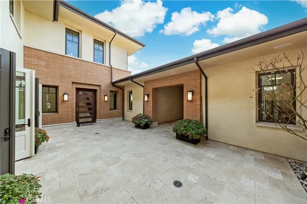an aerial view of residential houses with yard