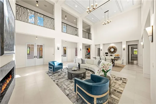 a living room with furniture a fireplace and a table