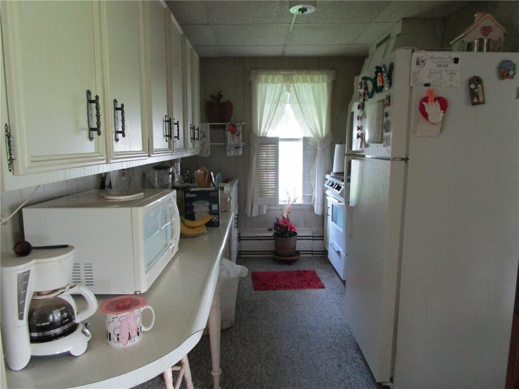 232 North Main Street Cambridge Springs, PA 16403 - Photo 11 of 23 a kitchen with refrigerator and stove