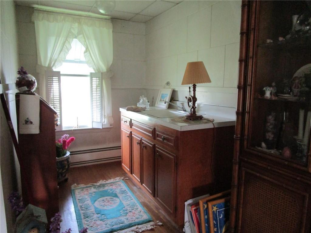 232 North Main Street Cambridge Springs, PA 16403 - Photo 14 of 23 a kitchen with a sink a stove and a window