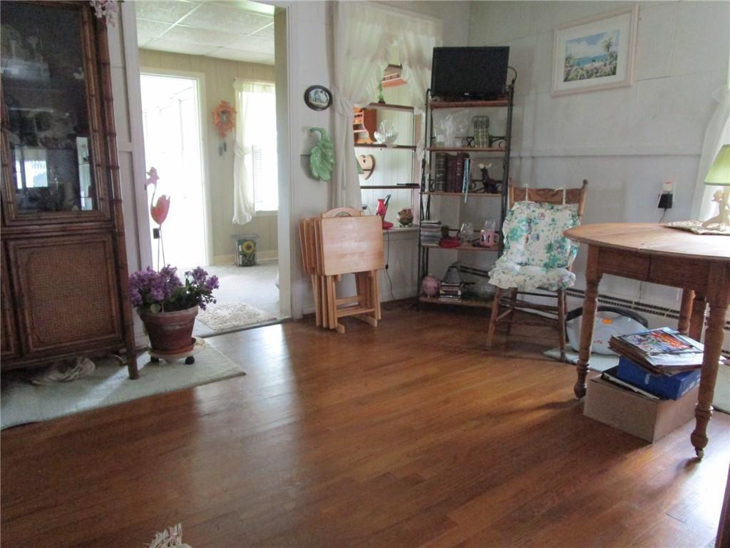 232 North Main Street Cambridge Springs, PA 16403 - Photo 10 of 23 a living room with furniture and a fireplace