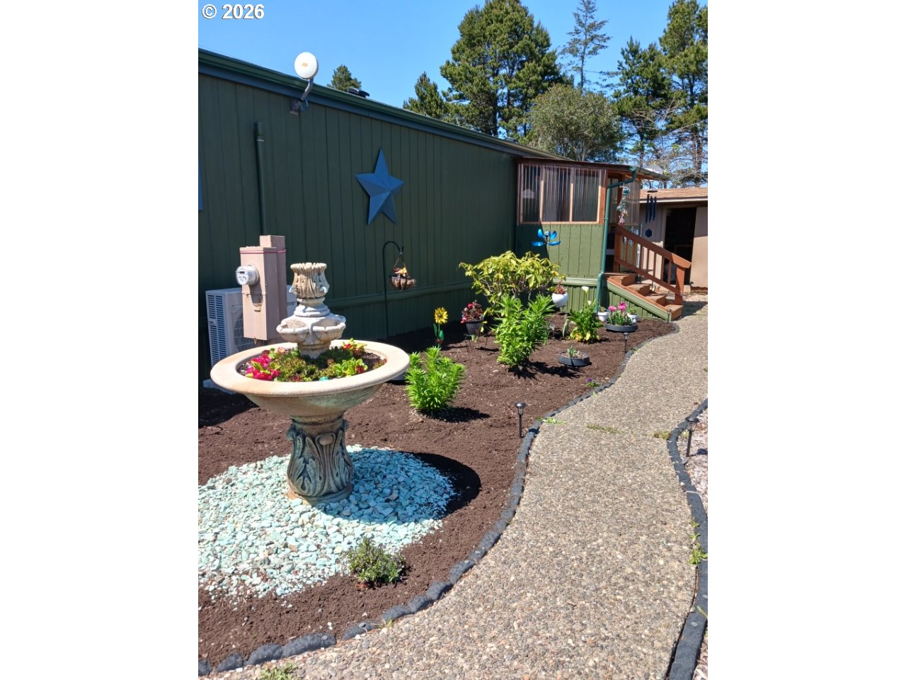 3760 Highway 101, Unit 1 Florence, OR 97439 - Photo 3 of 32 a view of a porch with furniture and a potted plant