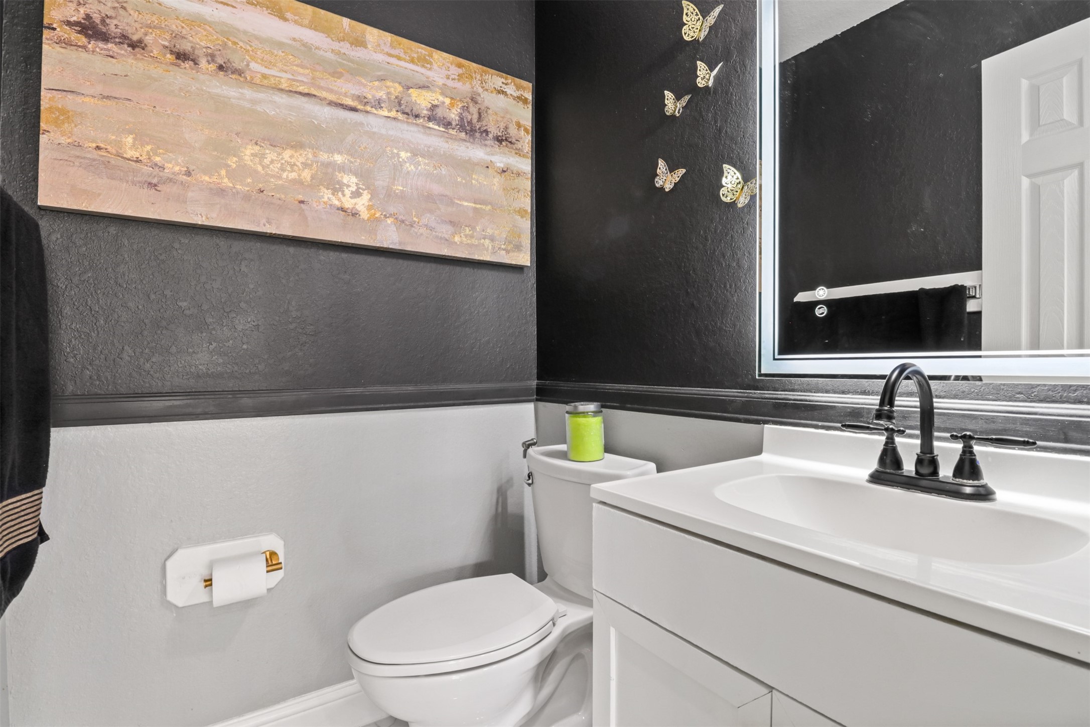 23027 Canal Road Richmond, TX 77406 - Photo 13 of 31 a bathroom with a sink a toilet and a mirror