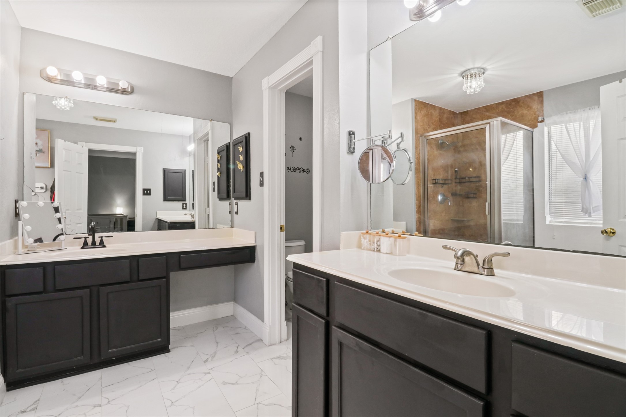 23027 Canal Road Richmond, TX 77406 - Photo 16 of 31 a bathroom with a sink double vanity and a mirror