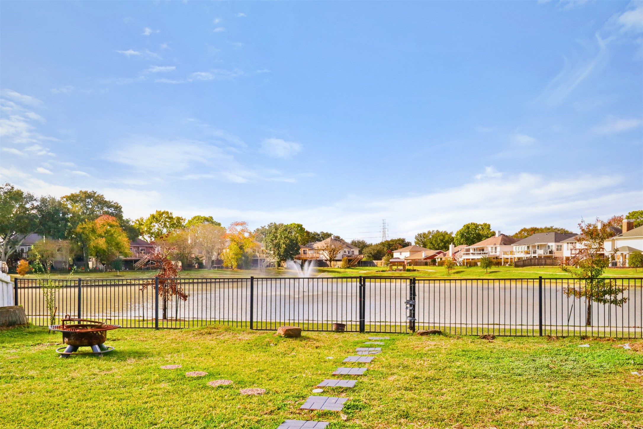 23027 Canal Road Richmond, TX 77406 - Photo 3 of 31 a swimming pool with lawn chairs
