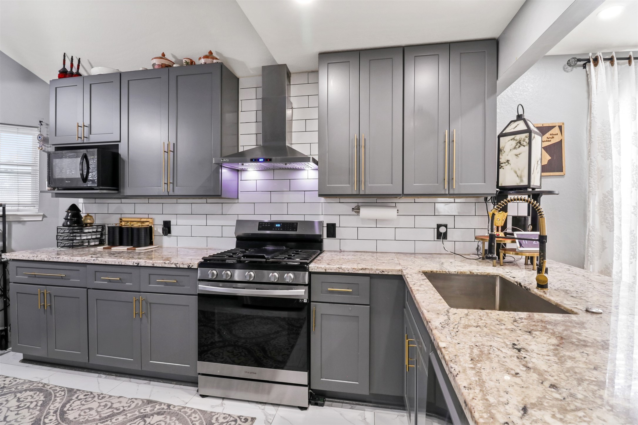 23027 Canal Road Richmond, TX 77406 - Photo 10 of 31 a kitchen with stainless steel appliances granite countertop a sink stove and refrigerator