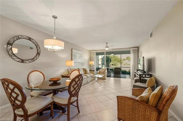 a kitchen with stainless steel appliances granite countertop a stove top oven a sink dishwasher and a refrigerator