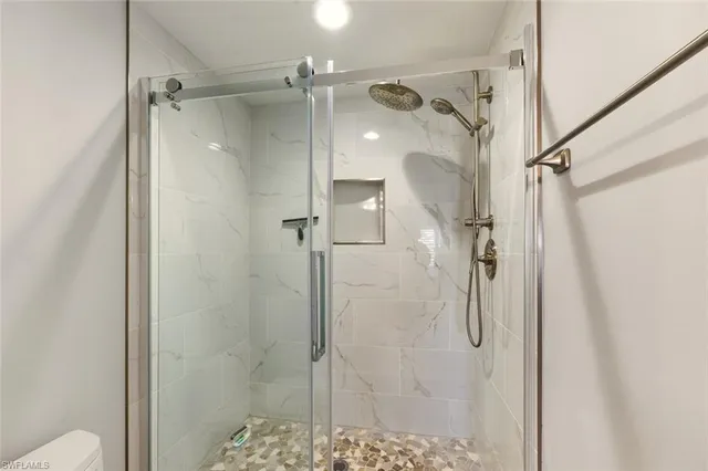 a front view of a house with a yard and outdoor seating