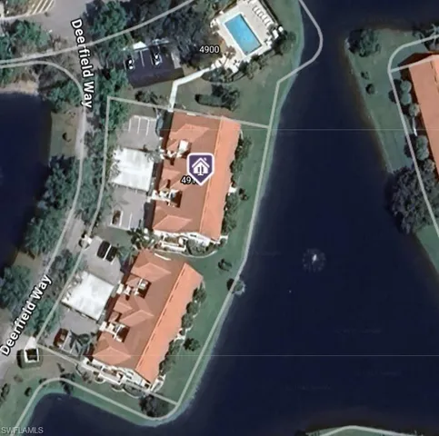 a view of a dining room with furniture wooden floor and chandelier