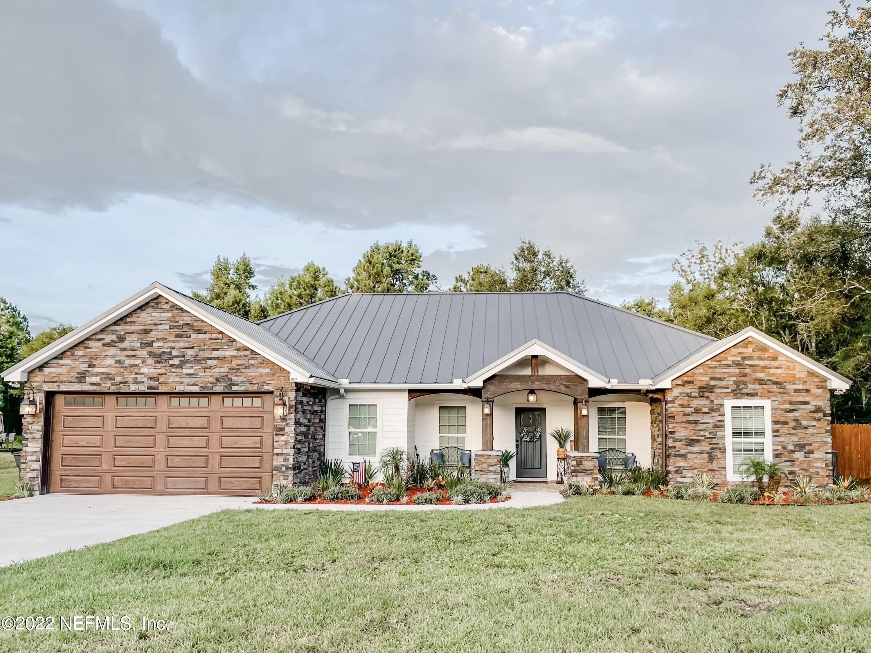 55832 Bear Run Road Callahan, FL 32011 - Photo 1 of 41 a view of a house with a yard and sitting area