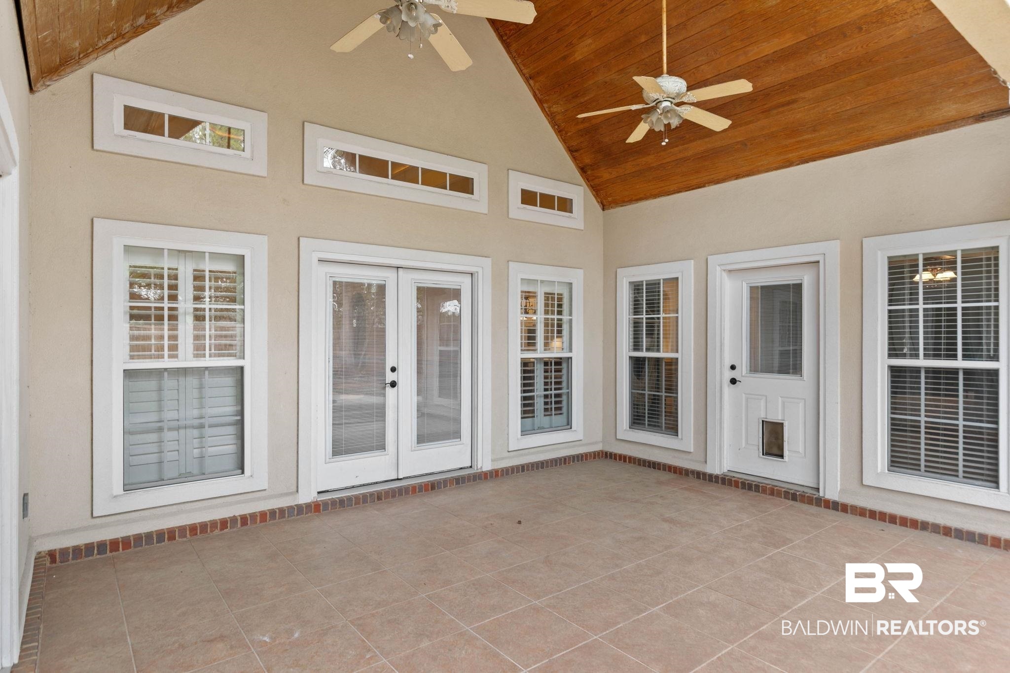 3668 Claridge Road North Mobile, AL 36608 - Photo 81 of 100 Unfurnished sunroom featuring ceiling fan, lofted ceiling, a patio, and french doors